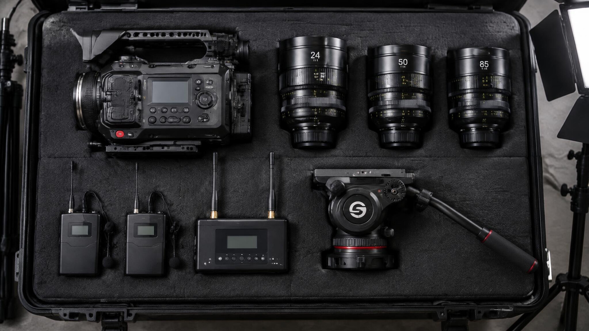 Broadcast camera equipment laid out for setup checks